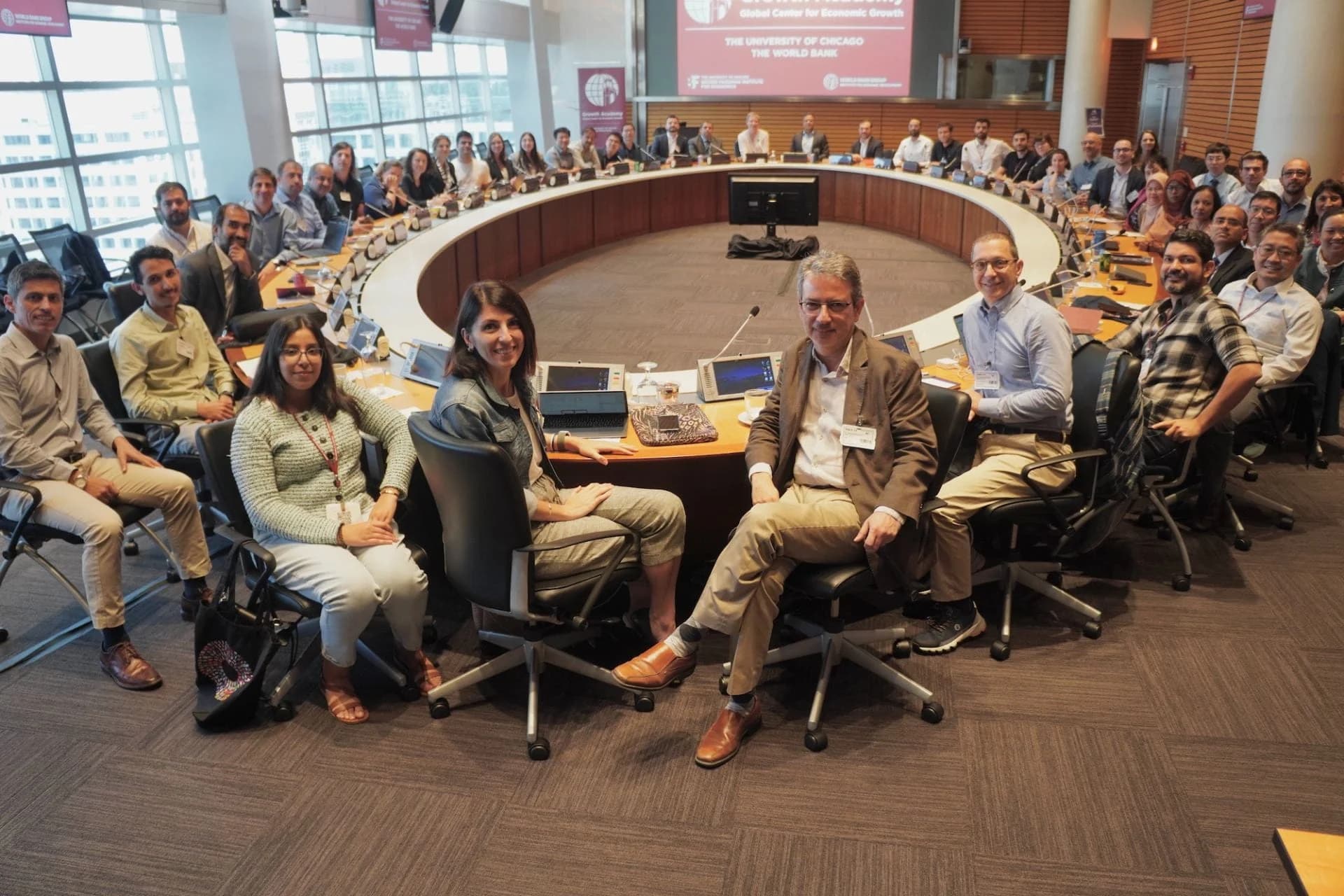 Growth Academy cohort seated around the round table at the World Bank Group