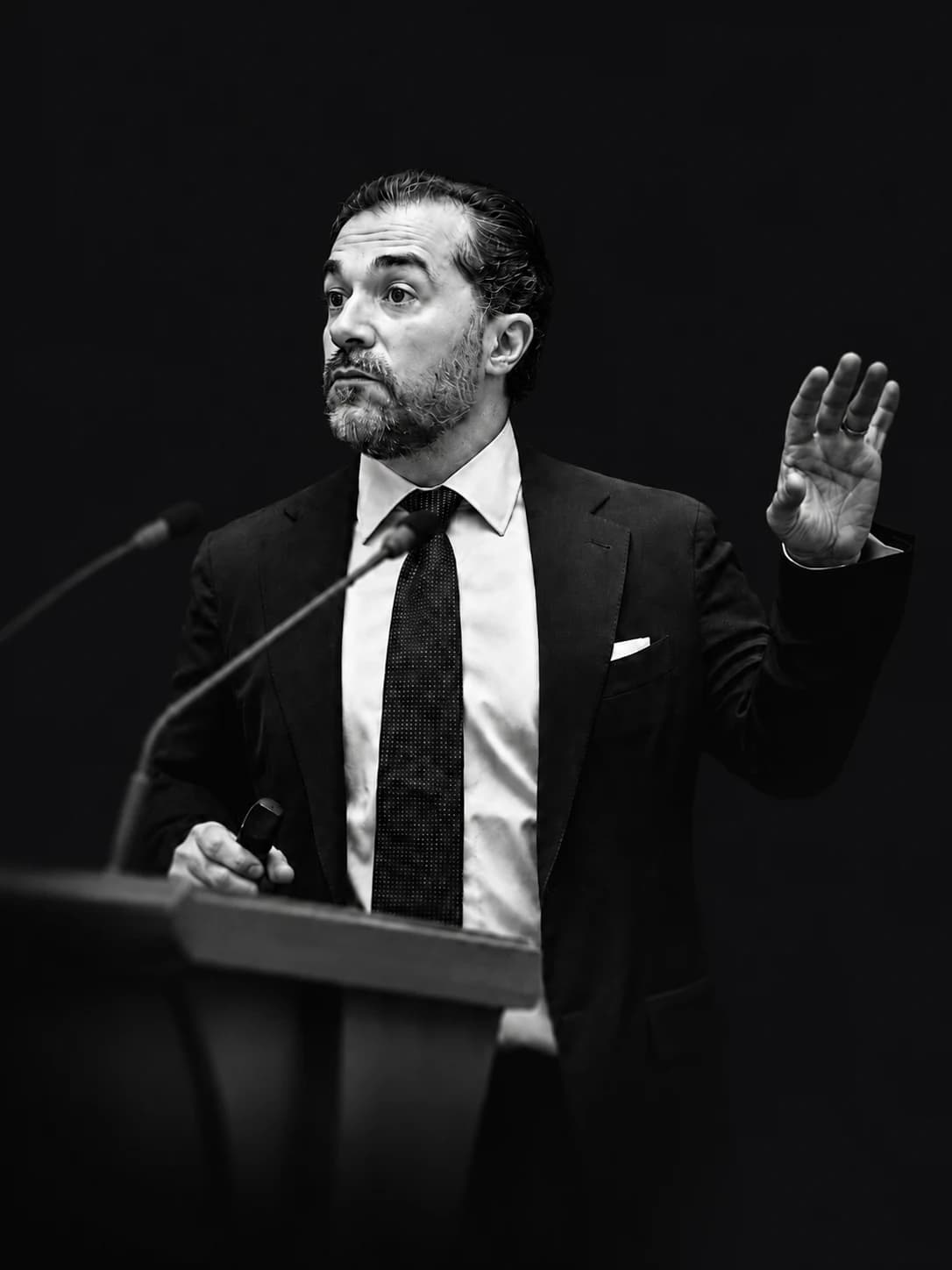 Ufuk Akcigit speaking at a lectern
